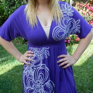 Small purple dress coverup with white detailing